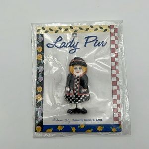 Vintage pin, Susan Paley lady in dress and jacket